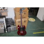 A Gibson Epiphone electric guitar with cherry lacquered body No. 90020688, 100 cm long.