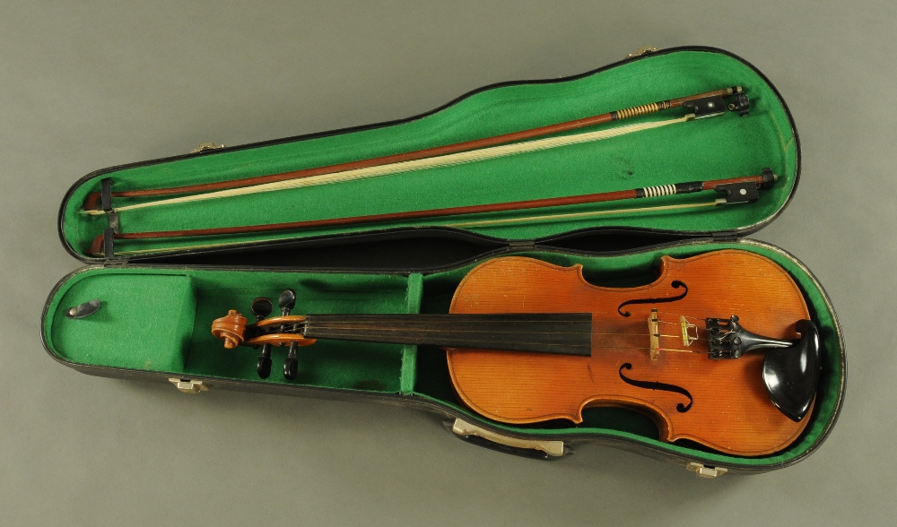 A 19th century full size violin with figured two piece back,