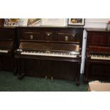 An Edwardian figured walnut John Spencer & Co upright piano, retailed by Murdoch,