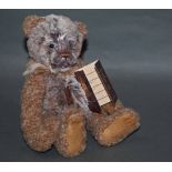 A soft plush "Benny" Charlie Bear, CB171779A, having brown and grey tinged fur body,