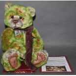 A soft plush "Brussell" Charlie Bear, CB631486, having green and brown tinged fur body,