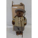 A Lakeland Bears teddy bear, titled "Captain", wearing a tweed flat cap, waist coat,