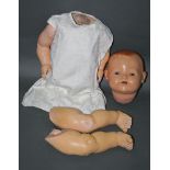 A German Heinrich Handwerck bisque head doll, having sleep eyes, open mouth and two teeth,