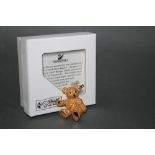 A Steiff gold coloured teddy bear brooch, made exclusively for Steiff by Swarovski,