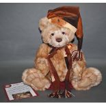 A soft plush "Santa Paws" Charlie Bear, CB621390, having beige fur covered body,