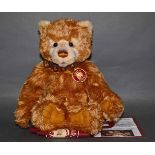 A soft plush "Lionheart" Charlie Bear, CB131326, having a golden or blonde fur covered body,