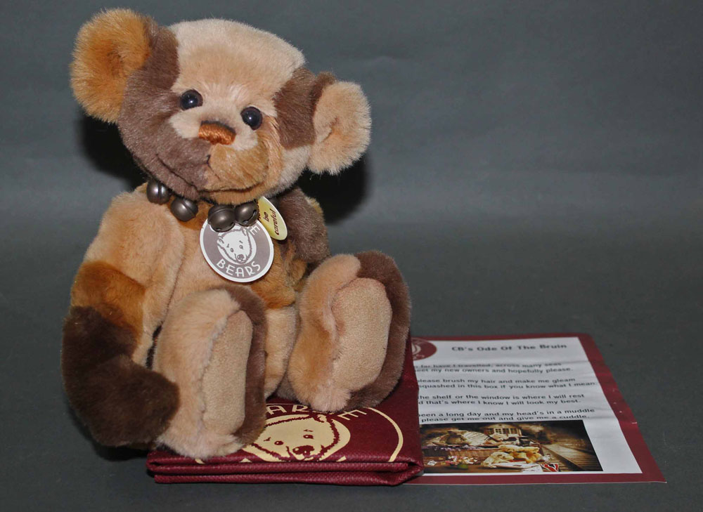 A soft plush "Phillip" Charlie Bear, CB114748B, having patterned brown fur body,