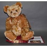 A soft plush "Chip" Charlie Bear, CB131399A, having a blonde or golden fur covered body,