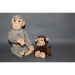 A 1930's Schuco Yes/No Monkey, having a light grey mohair covered body, in working order,
