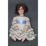 An early 20th century German Heubach Koppelsdorf bisque head doll, having sleep eyes,