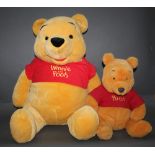 One large and one small Walt Disney Company "Winnie The Pooh", soft toys,