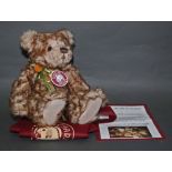 A soft plush "Button" Charlie Bear, CB194513, having a light brown and beige ruffled fur body,