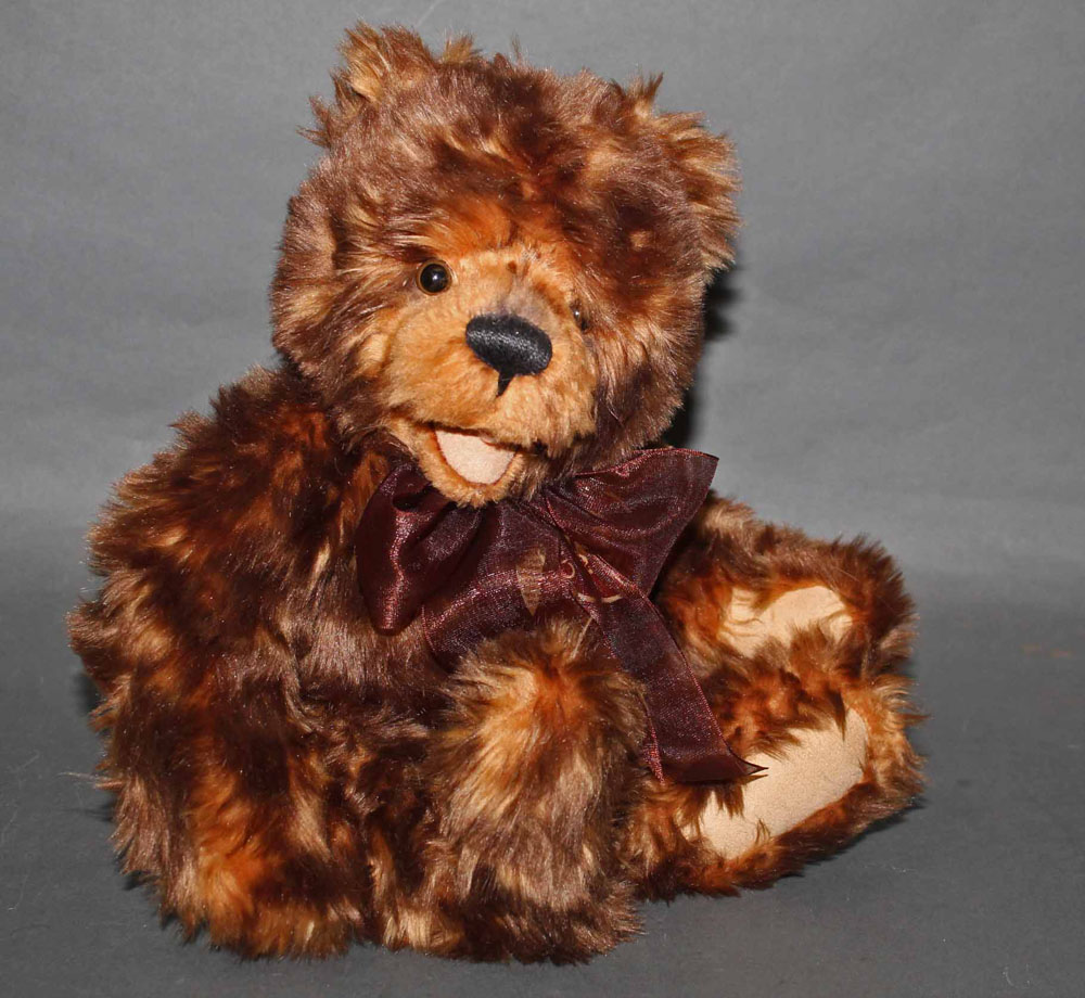 A soft plush "Nic Nak" Charlie Bear, CB0104393, having brown fur covered body, open mouth,