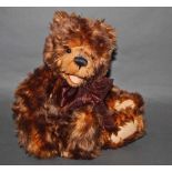 A soft plush "Nic Nak" Charlie Bear, CB0104393, having brown fur covered body, open mouth,