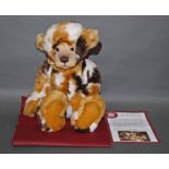 A soft plush "Leonie" Charlie Bear, CB124915, having a blonde, brown, and white patch fur body,