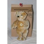 A Steiff Classic 1951 replica teddy bear, having a blonde mohair covered body,