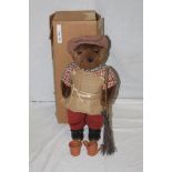 A Lakeland Bears teddy bear, titled "Clegg Pedlar", wearing a patterned flat cap,