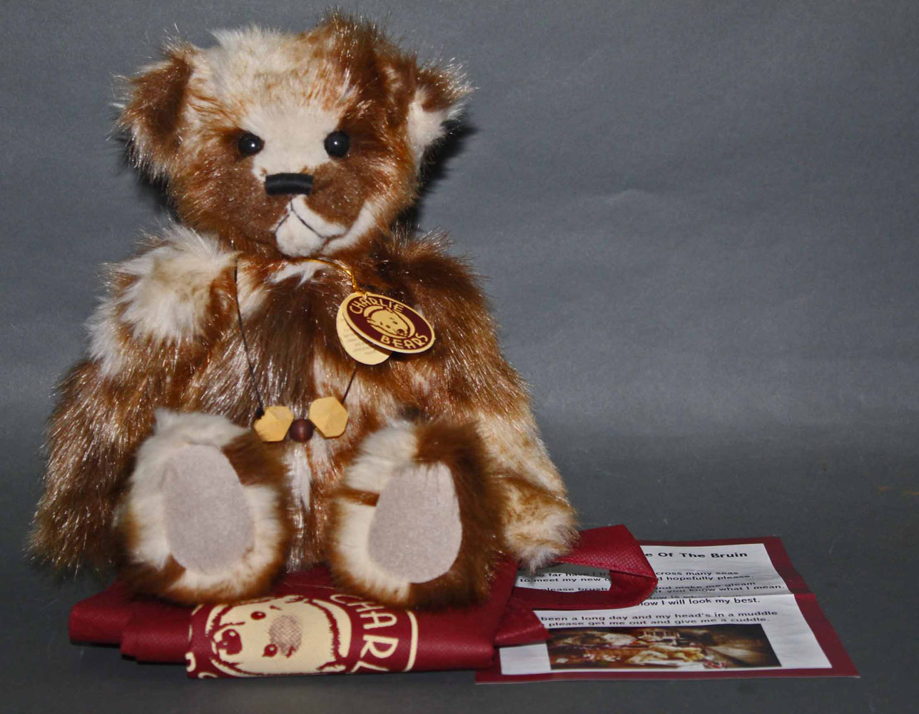 A soft plush "Tickle" Charlie Bear, CB630310D, having a beige and brown long fur covered body,