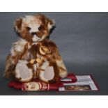A soft plush "Tickle" Charlie Bear, CB630310D, having a beige and brown long fur covered body,