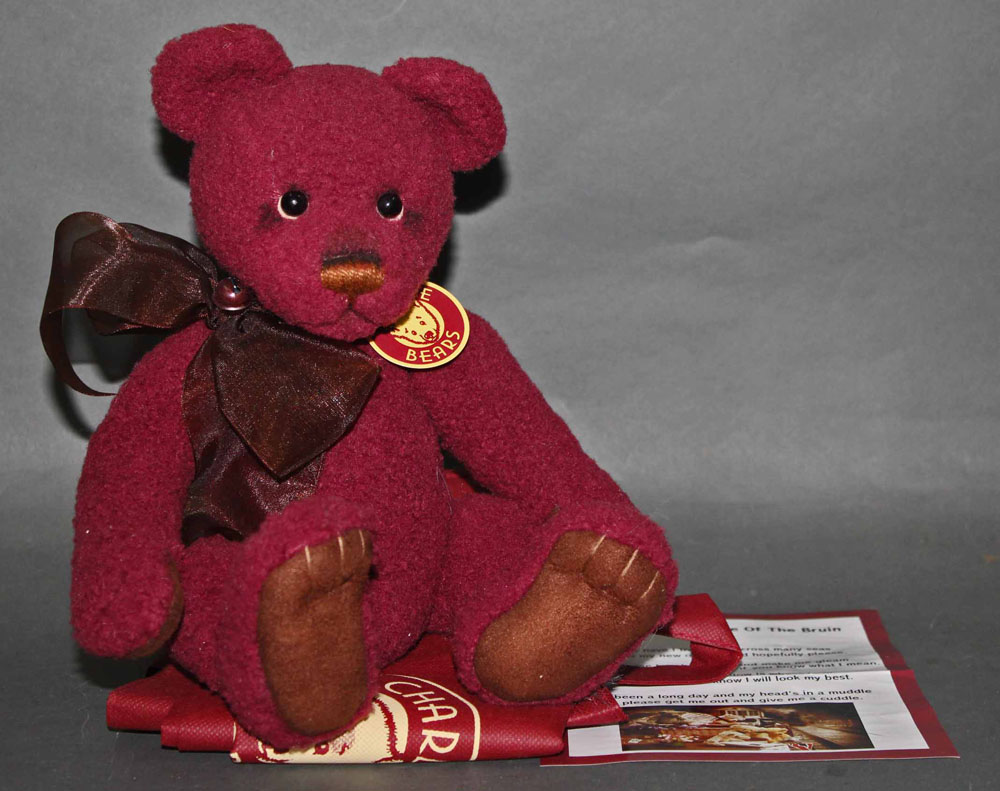 A soft plush "Clause" Charlie Bear, CB121338, having a burgundy coloured woven body,