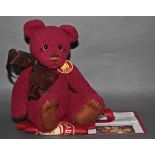 A soft plush "Clause" Charlie Bear, CB121338, having a burgundy coloured woven body,