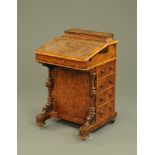 A Victorian walnut Davenport desk, with rear stationery compartment,
