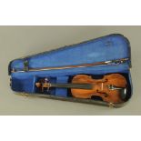 A 19th century violin, with one piece back. 36 cm, cased and with unmarked bow.