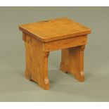 A small adzed oak rectangular stool, 26 x 22 x 24 cm high.