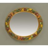 A Barbola oval mirror with bevelled plate,
