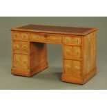 A late Victorian burr oak desk, with rounded corners,