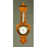 An Edwardian inlaid rosewood aneroid barometer, with mercury thermometer. Height 68 cm.