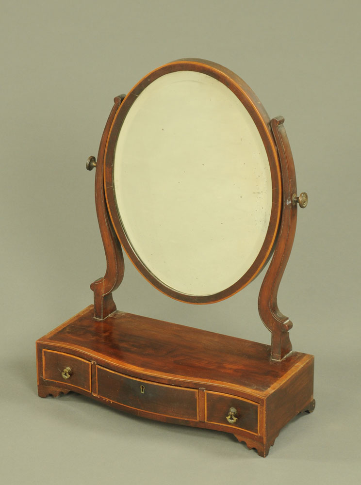 A 19th century mahogany dressing table mirror, oval with bevelled glass,