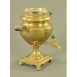 A brass Samovar with wooden handles and tap. Height 34 cm, width 31 cm.