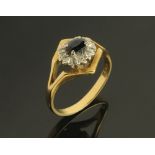 An 18 ct gold diamond and sapphire cluster ring, Size P, 4.5 grams.