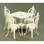 A set of four Victorian style white painted alloy garden chairs, together with a matching table.