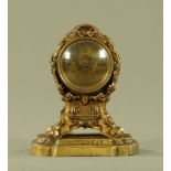 A miniature brass mantle clock, with pocket watch Verge movement by Thomas Hall Rumsey.