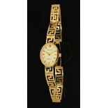 A 9 ct gold cased ladies Accurist wristwatch with 9 ct gold bracelet, 12.2 grams gross.