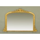 A 19th century gilt framed overmantle mirror, with foliate pediment above the moulded frame.