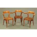 A Set of three 1920's laminated stained beech wood office armchairs by Thonet with labels to