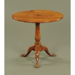 A 19th century tripod table,
