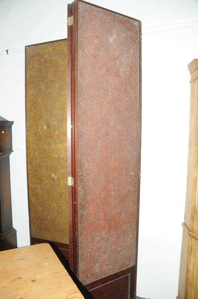A massive mahogany four fold screen, with gilt embossed cloth panels. - Image 9 of 10