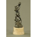 A vintage bronzed metal figure of a water carrier, raised on an alabaster base. Height 24 cm.