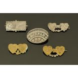 A collection of three silver and two plated Mizpah brooches.