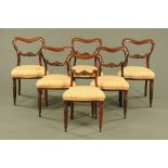 A set of six Victorian rosewood dining chairs, with drop in seats and raised on turned front legs.