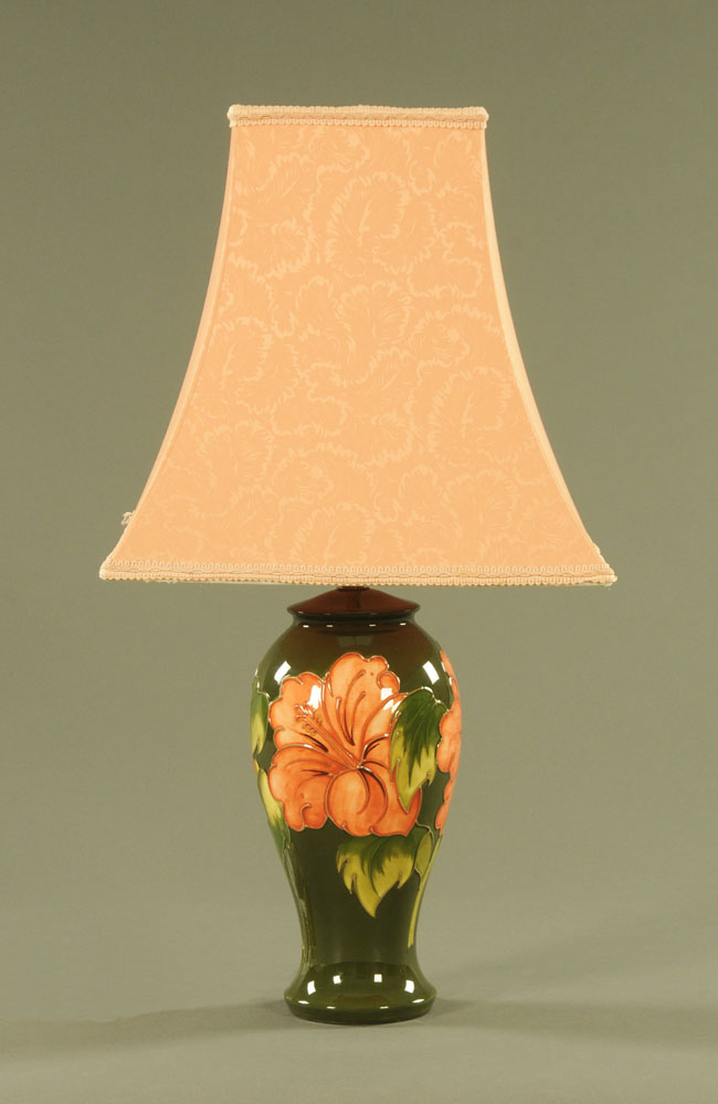 A large Moorcroft orchid pattern table lamp, with green ground, impressed Moorcroft,