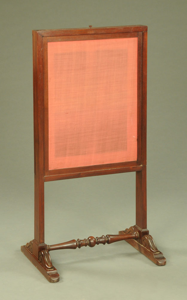 A Victorian mahogany fire screen, with lift up slide and turned low stretcher.