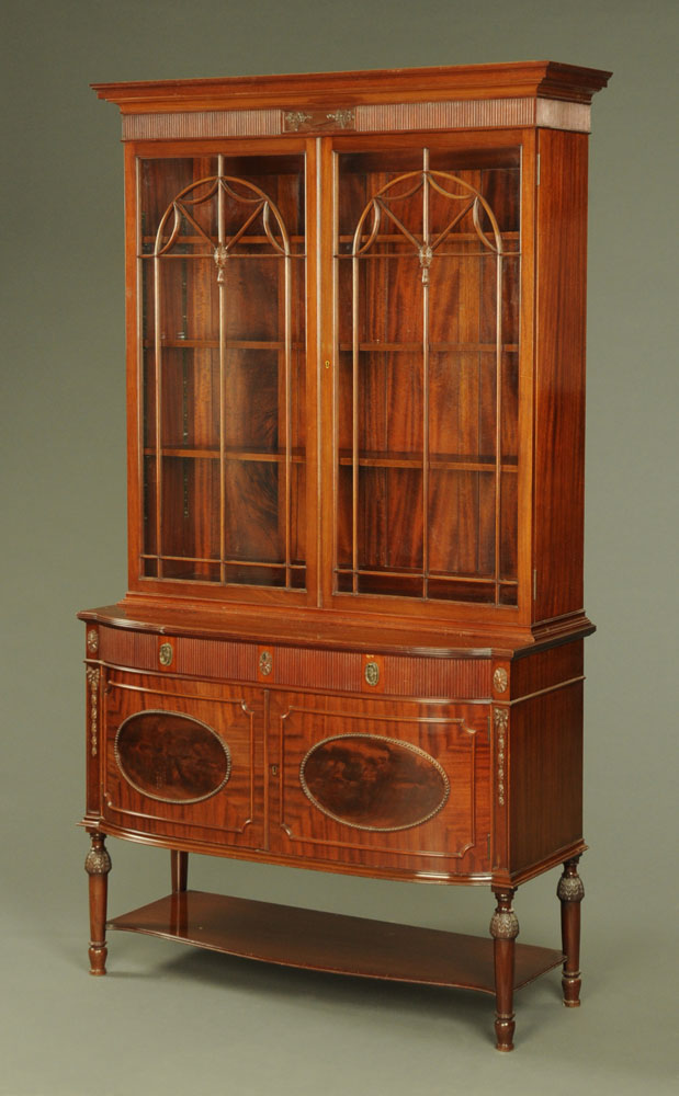 An Edwardian inlaid mahogany combined bookcase and desk,