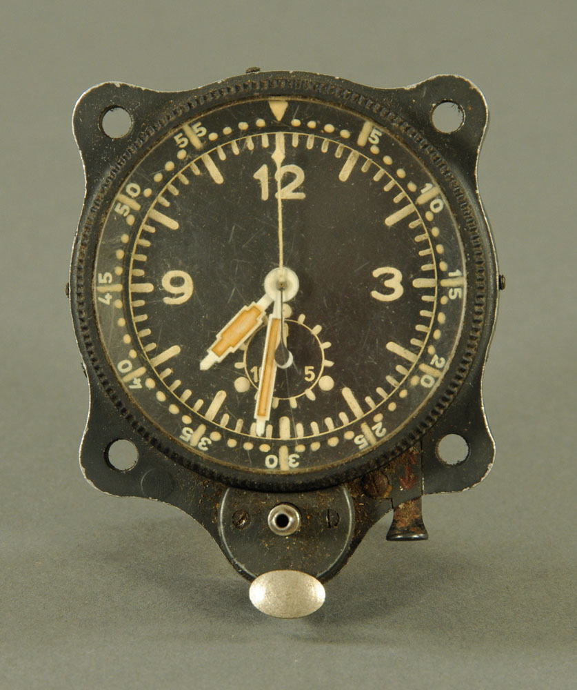 A Second world War Messerschmitt cockpit clock, in aluminium case. Width 6 cm. Serial No.