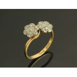 An 18 ct gold diamond daisy crossover cluster ring,Size P/Q.