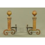 A large pair of iron fire dogs, with ball finials and square form supports with scroll feet.
